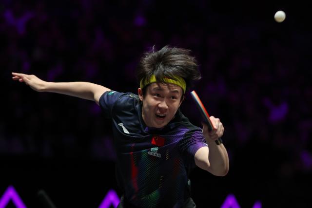 (260311) -- CHONGQING, March 11, 2026 (Xinhua) -- Wang Chuqin hits a return during the men's singles round of 32 match between Wang Chuqin of China and Jonathan Groth of Denmark at the WTT Champions Chongqing 2026 in southwest China's Chongqing, March 11, 2026. (Xinhua/Huang Wei)