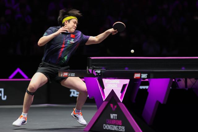 (260311) -- CHONGQING, March 11, 2026 (Xinhua) -- Wang Chuqin hits a return during the men's singles round of 32 match between Wang Chuqin of China and Jonathan Groth of Denmark at the WTT Champions Chongqing 2026 in southwest China's Chongqing, March 11, 2026. (Xinhua/Huang Wei)
