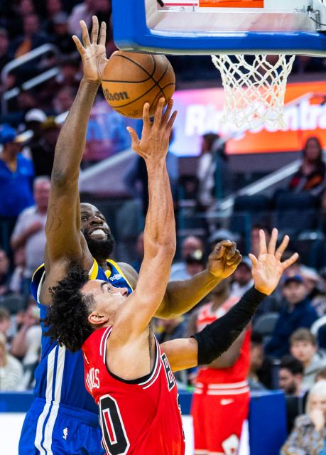 (260311) -- SAN FRANCISCO, March 11, 2026 (Xinhua) -- Draymond Green (L) of Golden State Warriors competes during the 2025-2026 NBA regular season basketball game between Chicago Bulls and Golden State Warriors in San Francisco, the United States, March 10, 2026. (Photo by Dong Xudong/Xinhua)