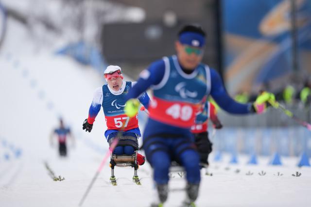 (260311) -- TESERO, March 11, 2026 (Xinhua) -- Ivan Golubkov (1st L) of Russia competes during the final match of the men's 10km interval start sitting of Para Cross-Country Skiing at the Milan-Cortina 2026 Paralympic Winter Games in Tesero, Italy, March 11, 2026. (Xinhua/Lian Zhen)