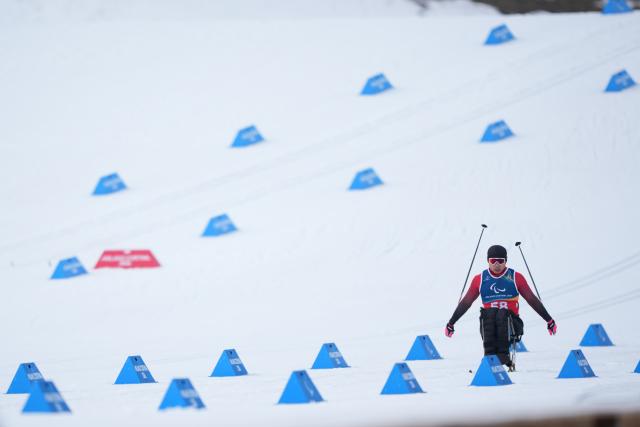 (260311) -- TESERO, March 11, 2026 (Xinhua) -- Zheng Pneg of China competes during the final match of the men's 10km interval start sitting of Para Cross-Country Skiing at the Milan-Cortina 2026 Paralympic Winter Games in Tesero, Italy, March 11, 2026. (Xinhua/Lian Zhen)
