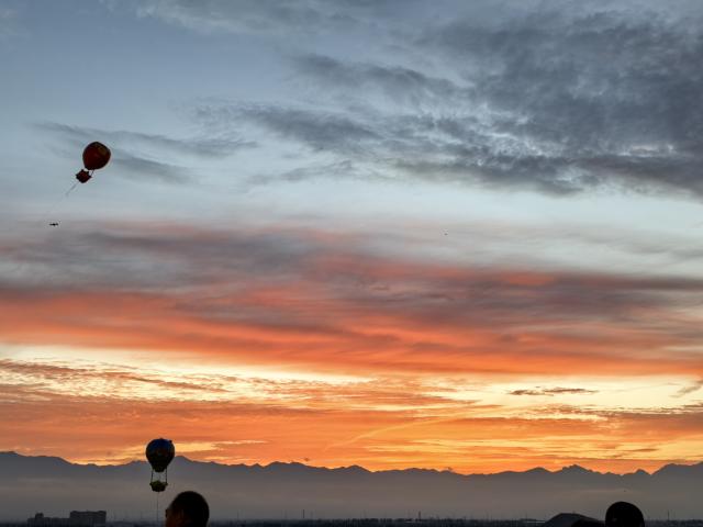 (260311) -- YINCHUAN, March 11, 2026 (Xinhua) -- This photo taken on July 4, 2025 shows sunset view seen from Lanshan Park, Yinchuan, northwest China's Ningxia Hui Autonomous Region. TO GO WITH "Economic Watch: More than a scenic view, sunset ignites tourism in NW China region" (Xinhua/Ma Sijia)
