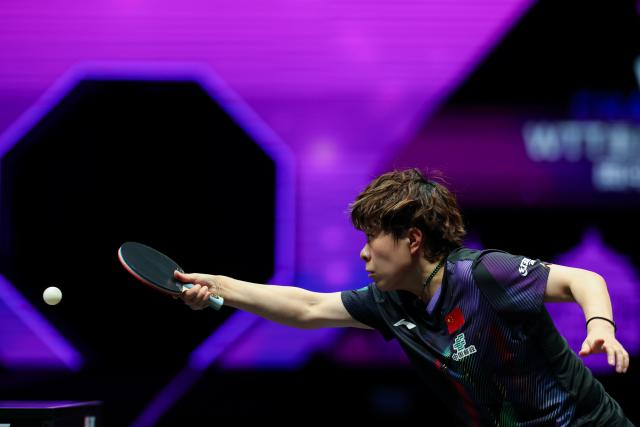 (260311) -- CHONGQING, March 11, 2026 (Xinhua) -- Wang Yidi of China hits a return during the women's singles round of 32 match against Hana Goda of Egypt at the WTT Champions Chongqing 2026 in southwest China's Chongqing, March 11, 2026. (Xinhua/Huang Wei)