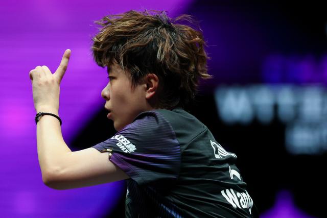 (260311) -- CHONGQING, March 11, 2026 (Xinhua) -- Wang Yidi of China reacts during the women's singles round of 32 match against Hana Goda of Egypt at the WTT Champions Chongqing 2026 in southwest China's Chongqing, March 11, 2026. (Xinhua/Huang Wei)