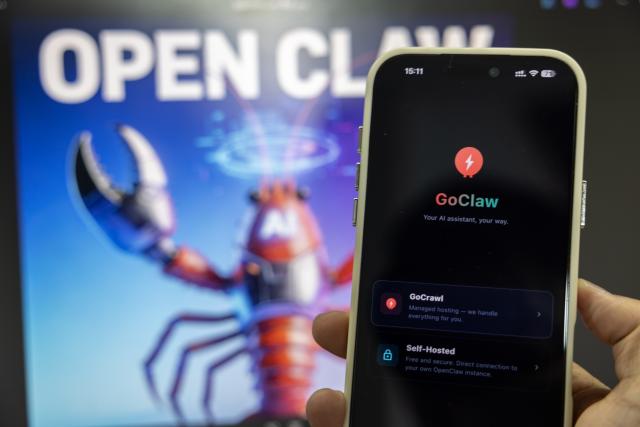 (260311) -- BEIJING, March 11, 2026 (Xinhua) -- This photo taken on March 11, 2026 shows the screen of a mobile phone running the open-source AI agent OpenClaw at Wuxing District of Huzhou City, east China's Zhejiang Province. "Raising lobster" and one-person companies (OPCs), which have sparked heated discussions in China's AI community and among the public, are also hot topics at the country's ongoing "two sessions" this year.
   The term "raising lobster" originated from the open-source AI agent OpenClaw, which uses a red lobster as its icon. It has since become a buzzword, adopted by Chinese users to describe the process of setting up and training this smart assistant. 
   TO GO WITH "Economic Watch: 'Claw-powered' one-person companies become hot topic at China's 'two sessions'" (Photo by Yi Fan/Xinhua)