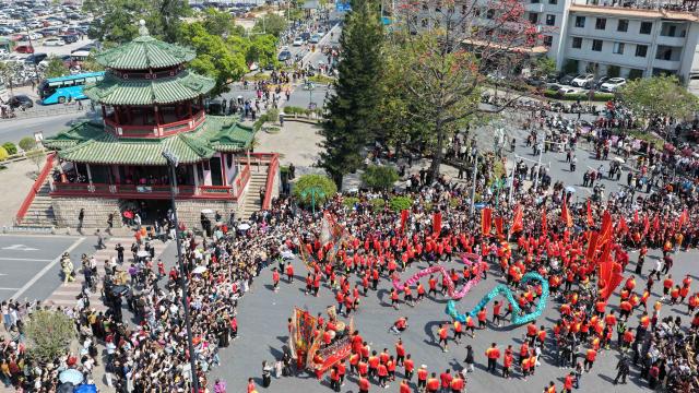(260311) -- JIEYANG, March 11, 2026 (Xinhua) -- This aerial drone photo taken on March 11, 2026 shows a parade during the Chenghuang temple fair in Jieyang, south China's Guangdong Province. The Chenghuang temple fair, held on the 23rd day of the first month on the traditional Chinese calendar, is one of the major traditional folk cultural events in Jieyang. (Xinhua/Deng Hua)