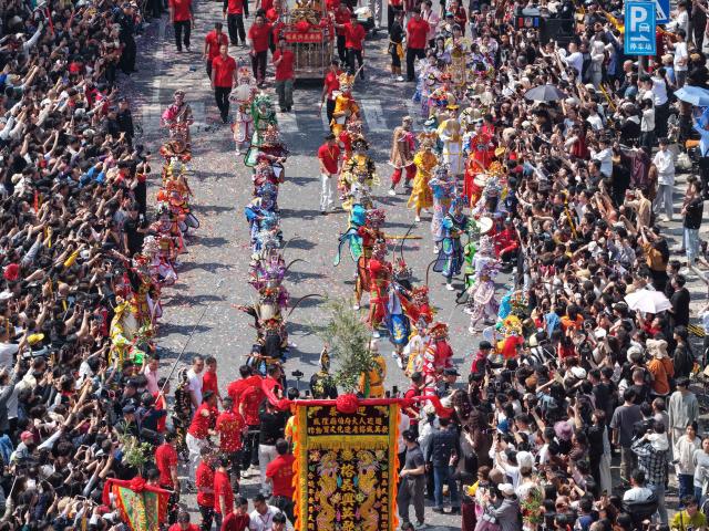 (260311) -- JIEYANG, March 11, 2026 (Xinhua) -- This aerial drone photo taken on March 11, 2026 shows a Yingge dance, or "dance to the hero's song," during the Chenghuang temple fair in Jieyang, south China's Guangdong Province. The Chenghuang temple fair, held on the 23rd day of the first month on the traditional Chinese calendar, is one of the major traditional folk cultural events in Jieyang. (Xinhua/Deng Hua)