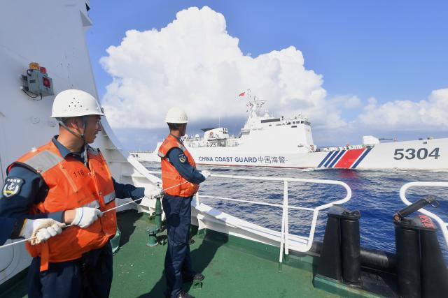 (260311) -- SOUTH CHINA SEA, March 11, 2026 (Xinhua) -- Law enforcers conduct formation collaboration training aboard the China Coast Guard (CCG) vessel Sandu in the South China Sea, Feb. 28, 2026. The CCG vessel Sandu conducted patrols in the South China Sea to safeguard China's territorial sovereignty and maritime rights and interests. (Xinhua/Mao Jun)