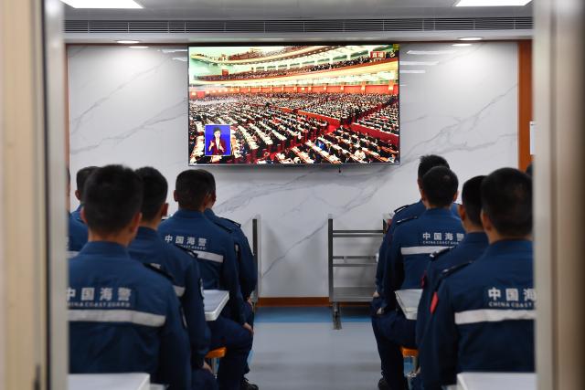 (260311) -- SOUTH CHINA SEA, March 11, 2026 (Xinhua) -- Law enforcers watch live news report on TV aboard the China Coast Guard (CCG) vessel Sandu in the South China Sea, March 5, 2026. The CCG vessel Sandu conducted patrols in the South China Sea to safeguard China's territorial sovereignty and maritime rights and interests. (Xinhua/He Xinyuan)