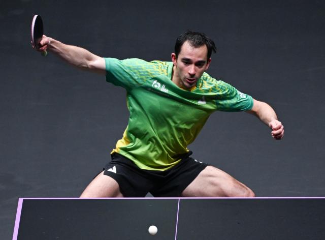 (260311) -- CHONGQING, March 11, 2026 (Xinhua) -- Hugo Calderano of Brazil hits a return during the men's singles round of 32 match against Chen Yuanyu of China at the WTT Champions Chongqing 2026 in southwest China's Chongqing, March 11, 2026. (Xinhua/Chen Cheng)