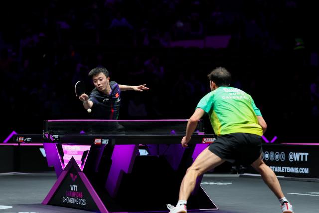 (260311) -- CHONGQING, March 11, 2026 (Xinhua) -- Chen Yuanyu of China hits a return during the men's singles round of 32 match against Hugo Calderano of Brazil at the WTT Champions Chongqing 2026 in southwest China's Chongqing, March 11, 2026. (Xinhua/Huang Wei)