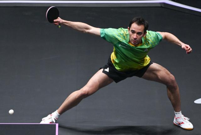 (260311) -- CHONGQING, March 11, 2026 (Xinhua) -- Hugo Calderano of Brazil hits a return during the men's singles round of 32 match against Chen Yuanyu of China at the WTT Champions Chongqing 2026 in southwest China's Chongqing, March 11, 2026. (Xinhua/Chen Cheng)
