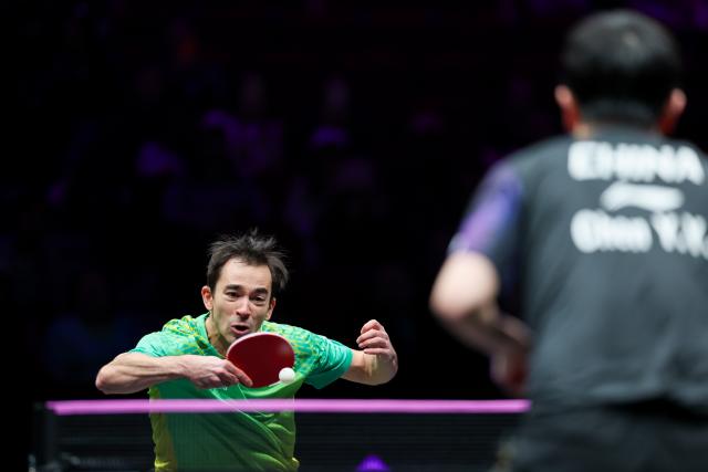 (260311) -- CHONGQING, March 11, 2026 (Xinhua) -- Hugo Calderano of Brazil hits a return during the men's singles round of 32 match against Chen Yuanyu of China at the WTT Champions Chongqing 2026 in southwest China's Chongqing, March 11, 2026. (Xinhua/Huang Wei)