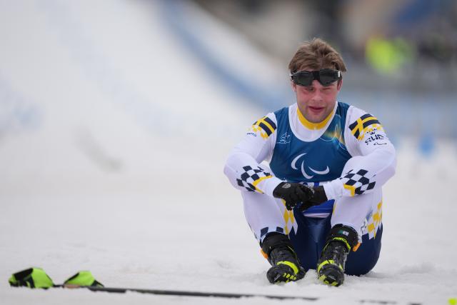 (260311) -- TESERO, March 11, 2026 (Xinhua) -- Zebastian Modin of Sweden reacts after the men's 10km interval start classic Vision Impaired of Para Cross-Country Skiing at the Milan-Cortina 2026 Paralympic Winter Games in Tesero, Italy, March 11, 2026. (Xinhua/Lian Zhen)
