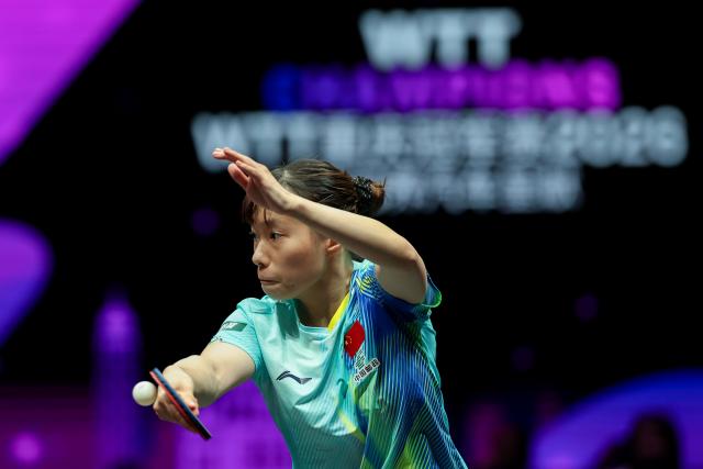 (260311) -- CHONGQING, March 11, 2026 (Xinhua) -- Shi Xunyao of China hits a return during the women's singles round of 32 match against Yuan Jianan of France at the WTT Champions Chongqing 2026 in southwest China's Chongqing, March 11, 2026. (Xinhua/Huang Wei)