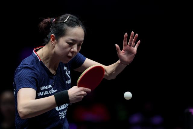 (260311) -- CHONGQING, March 11, 2026 (Xinhua) -- Yuan Jianan of France hits a return during the women's singles round of 32 match against Shi Xunyao of China at the WTT Champions Chongqing 2026 in southwest China's Chongqing, March 11, 2026. (Xinhua/Huang Wei)