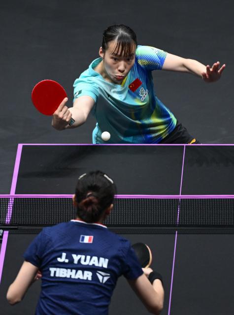 (260311) -- CHONGQING, March 11, 2026 (Xinhua) -- Shi Xunyao of China hits a return during the women's singles round of 32 match against Yuan Jianan of France at the WTT Champions Chongqing 2026 in southwest China's Chongqing, March 11, 2026. (Xinhua/Chen Cheng)