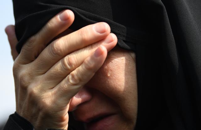 (260311) -- TEHRAN, March 11, 2026 (Xinhua) -- A woman attends a funeral held for Iranian high-ranking military commanders killed during strikes launched by the United States and Israel against Iran in Tehran, Iran, March 11, 2026. (Xinhua/Shadati)