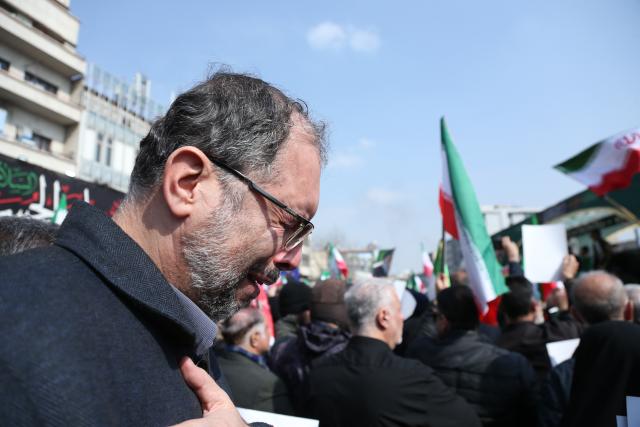 (260311) -- TEHRAN, March 11, 2026 (Xinhua) -- A man attends a funeral held for Iranian high-ranking military commanders killed during strikes launched by the United States and Israel against Iran in Tehran, Iran, March 11, 2026. (Xinhua/Shadati)