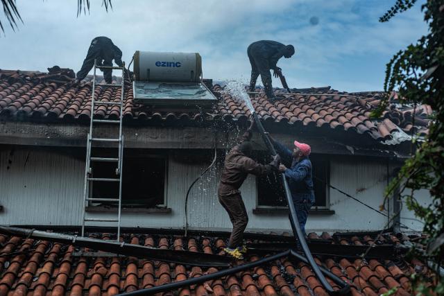 (260311) -- GOMA, March 11, 2026 (Xinhua) -- Rescue workers put out fire after a drone attack in Goma, eastern Democratic Republic of the Congo (DRC), on March 11, 2026. Explosions were heard on Wednesday morning. The March 23 Movement (M23) rebel group attributed a drone strike to the Congolese government's military forces. According to a provisional toll released by M23, three people were killed, including a French national working for the United Nations Children's Fund. (Str/Xinhua)