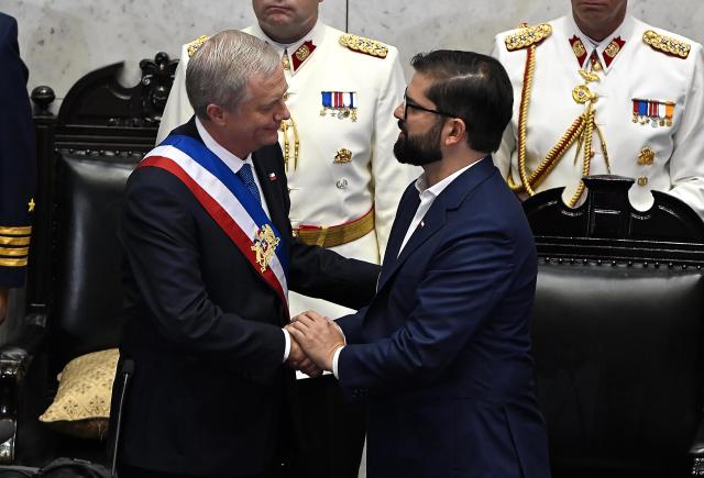 (260311) -- SANTIAGO, March 11, 2026 (Xinhua) -- Chile's new president Jose Antonio Kast (L) shakes hands with former President Gabriel Boric during the inauguration ceremony at the National Congress in Valparaiso, Chile, March 11, 2026. Kast took office on Wednesday as Chile's new president for the 2026-2030 term, succeeding Gabriel Boric. (Agencia UNO/Handout via Xinhua)