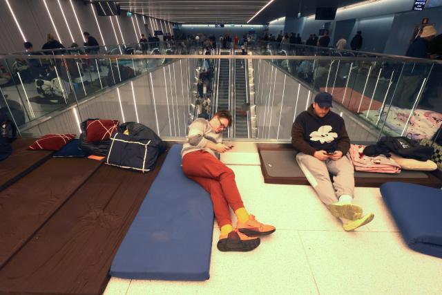 (260312) -- RAMAT GAN, March 12, 2026 (Xinhua) -- People spend the night on a platform of a subway station in Ramat Gan, Israel, on March 11, 2026. Alarms were activated across Israel on Wednesday night as air defenses detected missiles and rockets launched from Iran and Lebanon. (Photo by Gil Cohen Magen/Xinhua)