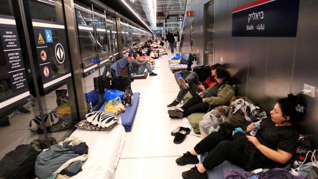 (260312) -- RAMAT GAN, March 12, 2026 (Xinhua) -- People spend the night on a platform of a subway station in Ramat Gan, Israel, on March 11, 2026. Alarms were activated across Israel on Wednesday night as air defenses detected missiles and rockets launched from Iran and Lebanon. (Photo by Gil Cohen Magen/Xinhua)