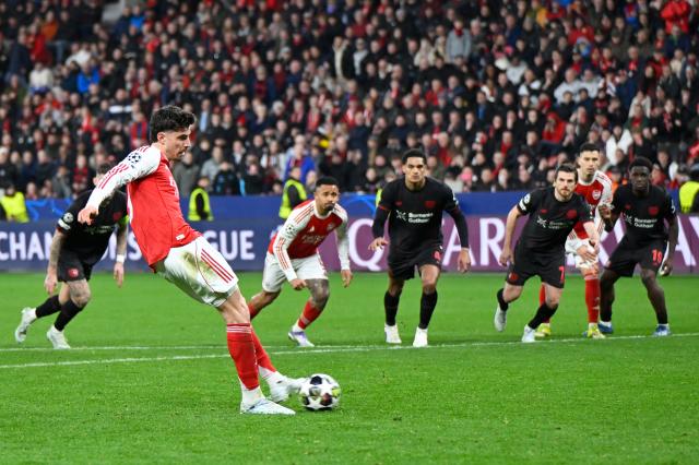 (260312) -- LEVERKUSEN, March 12, 2026 (Xinhua) -- Kai Havertz (front) of Arsenal shoots to score during the UEFA Champions League round of 16 first leg match between Bayer 04 Leverkusen and Arsenal in Leverkusen, Germany, March 11, 2026. (Photo by Ulrich Hufnagel/Xinhua)