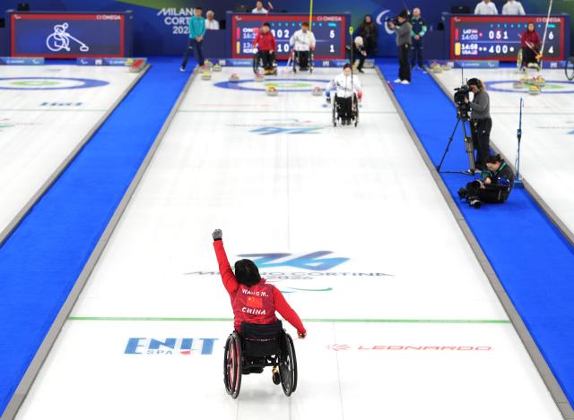 (260312) -- CORTINA D'AMPEZZO, March 12, 2026 (Xinhua) -- Wang Meng of China reacts during the wheelchair curling mixed doubles gold medal game between China and South Korea at the Milan-Cortina 2026 Paralympic Winter Games in Cortina D'ampezzo, Italy, March 11, 2026. (Xinhua/Cai Yang)
