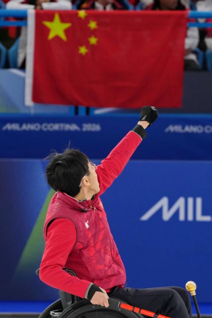 (260312) -- CORTINA D'AMPEZZO, March 12, 2026 (Xinhua) -- Yang Jinqiao of China reacts during the wheelchair curling mixed doubles gold medal game between China and South Korea at the Milan-Cortina 2026 Paralympic Winter Games in Cortina D'ampezzo, Italy, March 11, 2026. (Xinhua/Mu Yu)