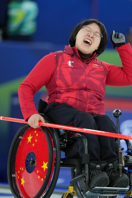 (260312) -- CORTINA D'AMPEZZO, March 12, 2026 (Xinhua) -- Wang Meng of China reacts during the wheelchair curling mixed doubles gold medal game between China and South Korea at the Milan-Cortina 2026 Paralympic Winter Games in Cortina D'ampezzo, Italy, March 11, 2026. (Xinhua/Lian Yi)