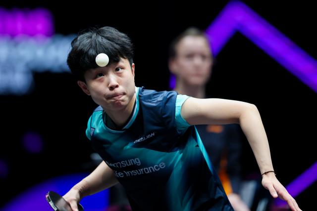 (260312) -- CHONGQING, March 12, 2026 (Xinhua) -- Joo Cheonhui of South Korea serves during the women's singles round of 32 match against Sun Yingsha of China at the WTT Champions Chongqing 2026 in southwest China's Chongqing, March 12, 2026. (Xinhua/Huang Wei)