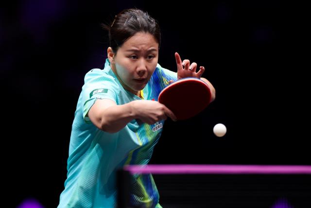 (260312) -- CHONGQING, March 12, 2026 (Xinhua) -- Chen Xingtong hits a return during the women's singles round of 32 match between Chen Xingtong of China and Sofia Polcanova of Austria at the WTT Champions Chongqing 2026 in southwest China's Chongqing, March 12, 2026. (Xinhua/Huang Wei)