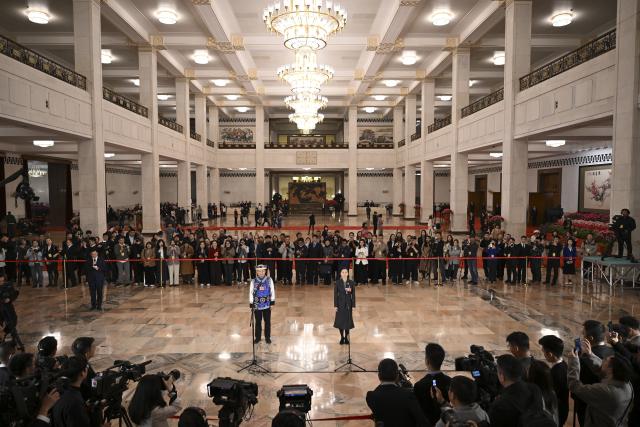 (260312) -- BEIJING, March 12, 2026 (Xinhua) -- Deputies to the 14th National People's Congress (NPC) attend a group interview ahead of the closing meeting of the fourth session of the 14th NPC at the Great Hall of the People in Beijing, capital of China, March 12, 2026. (Xinhua/Cai Xiangxin)