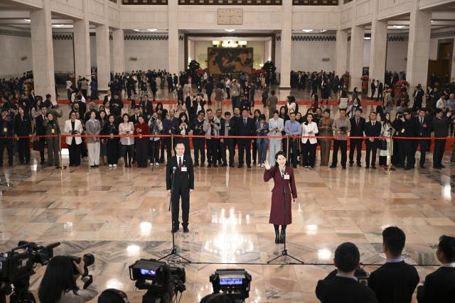 (260312) -- BEIJING, March 12, 2026 (Xinhua) -- Deputies to the 14th National People's Congress (NPC) attend a group interview ahead of the closing meeting of the fourth session of the 14th NPC at the Great Hall of the People in Beijing, capital of China, March 12, 2026. (Xinhua/Cai Xiangxin)