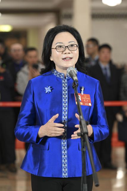 (260312) -- BEIJING, March 12, 2026 (Xinhua) -- Xia Hua, a deputy to the 14th National People's Congress (NPC), attends a group interview ahead of the closing meeting of the fourth session of the 14th NPC at the Great Hall of the People in Beijing, capital of China, March 12, 2026. (Xinhua/Cheng Tingting)