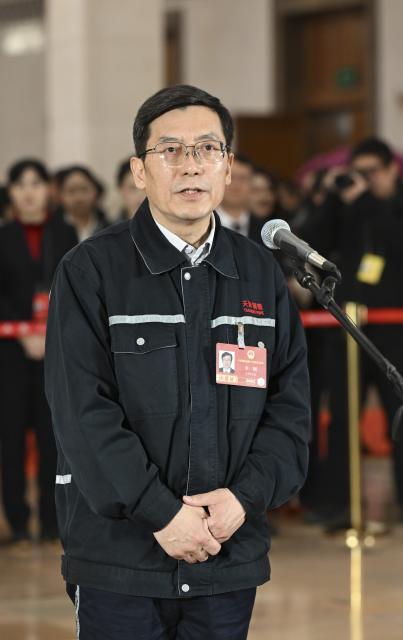 (260312) -- BEIJING, March 12, 2026 (Xinhua) -- Li Gang, a deputy to the 14th National People's Congress (NPC), attends a group interview ahead of the closing meeting of the fourth session of the 14th NPC at the Great Hall of the People in Beijing, capital of China, March 12, 2026. (Xinhua/Cheng Tingting)