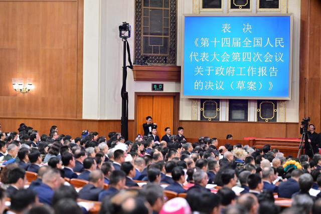 (260312) -- BEIJING, March 12, 2026 (Xinhua) -- The closing meeting of the fourth session of the 14th National People's Congress (NPC) is held at the Great Hall of the People in Beijing, capital of China, March 12, 2026. (Xinhua/Zhai Jianlan)
