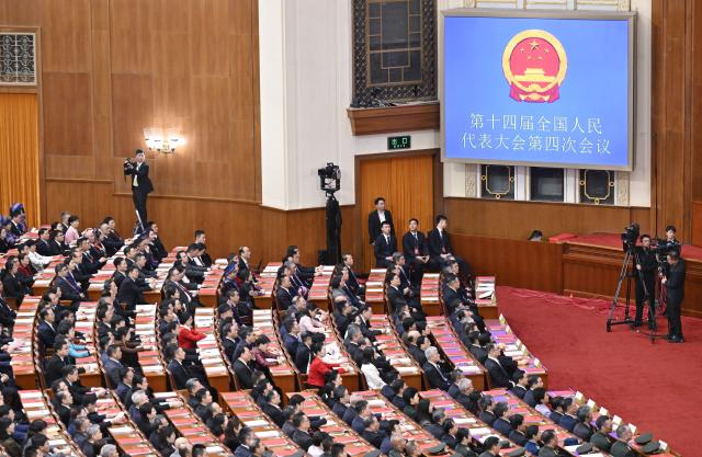 (260312) -- BEIJING, March 12, 2026 (Xinhua) -- The closing meeting of the fourth session of the 14th National People's Congress (NPC) is held at the Great Hall of the People in Beijing, capital of China, March 12, 2026. (Xinhua/Yue Yuewei)