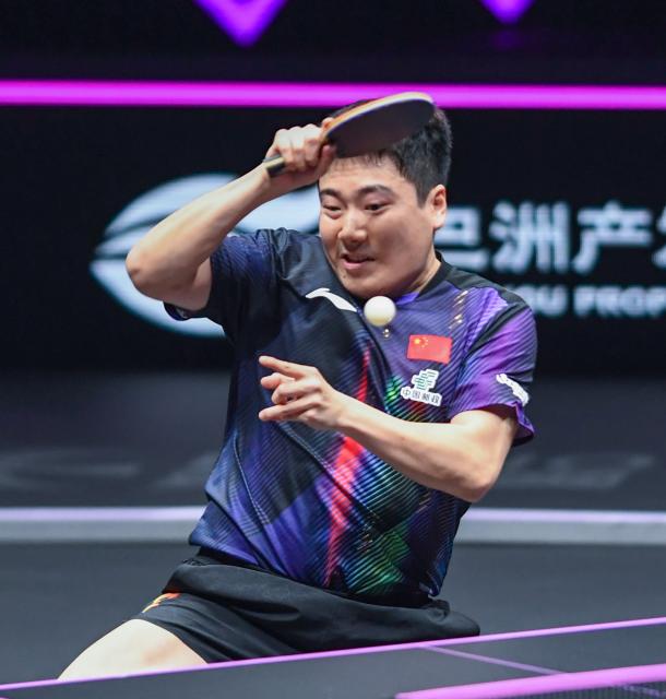 (260312) -- CHONGQING, March 12, 2026 (Xinhua) -- Liang Jingkun hits a return during the men's singles round of 32 match between Liang Jingkun of China and Xiang Peng of China at the WTT Champions Chongqing 2026 in southwest China's Chongqing, March 12, 2026. (Xinhua/Tang Yi)