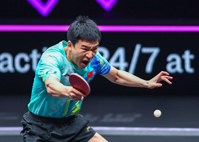 (260312) -- CHONGQING, March 12, 2026 (Xinhua) -- Xiang Peng hits a return during the men's singles round of 32 match between Liang Jingkun of China and Xiang Peng of China at the WTT Champions Chongqing 2026 in southwest China's Chongqing, March 12, 2026. (Xinhua/Tang Yi)