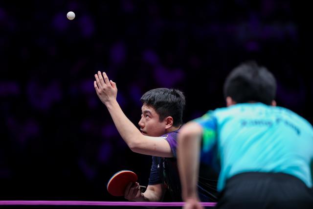 (260312) -- CHONGQING, March 12, 2026 (Xinhua) -- Liang Jingkun serves during the men's singles round of 32 match between Liang Jingkun of China and Xiang Peng of China at the WTT Champions Chongqing 2026 in southwest China's Chongqing, March 12, 2026. (Xinhua/Huang Wei)