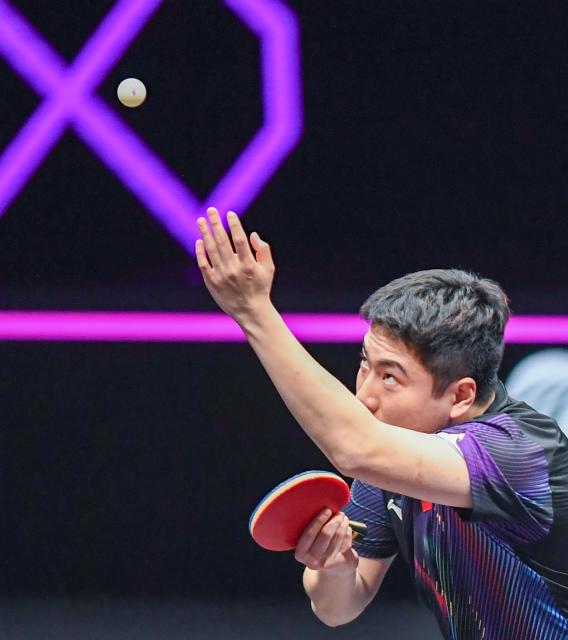 (260312) -- CHONGQING, March 12, 2026 (Xinhua) -- Liang Jingkun serves during the men's singles round of 32 match between Liang Jingkun of China and Xiang Peng of China at the WTT Champions Chongqing 2026 in southwest China's Chongqing, March 12, 2026. (Xinhua/Tang Yi)