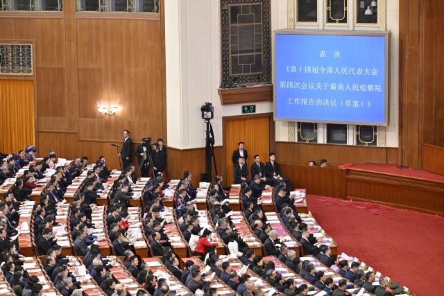 (260312) -- BEIJING, March 12, 2026 (Xinhua) -- The closing meeting of the fourth session of the 14th National People's Congress (NPC) is held at the Great Hall of the People in Beijing, capital of China, March 12, 2026. (Xinhua/Yue Yuewei)