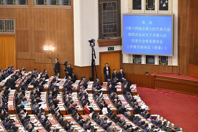 (260312) -- BEIJING, March 12, 2026 (Xinhua) -- The closing meeting of the fourth session of the 14th National People's Congress (NPC) is held at the Great Hall of the People in Beijing, capital of China, March 12, 2026. (Xinhua/Yue Yuewei)