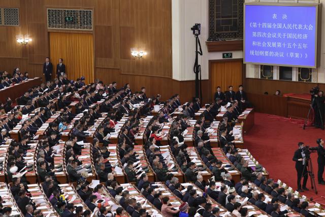 (260312) -- BEIJING, March 12, 2026 (Xinhua) -- The closing meeting of the fourth session of the 14th National People's Congress (NPC) is held at the Great Hall of the People in Beijing, capital of China, March 12, 2026. (Xinhua/Jin Liwang)