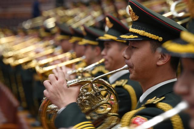 (260312) -- BEIJING, March 12, 2026 (Xinhua) -- The military band of the Chinese People's Liberation Army performs at the closing meeting of the fourth session of the 14th National People's Congress (NPC) at the Great Hall of the People in Beijing, capital of China, March 12, 2026. (Xinhua/Li Minggang)