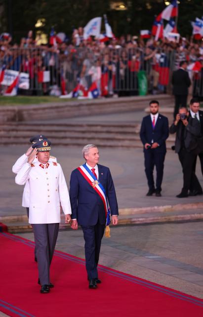 (260312) -- SANTIAGO, March 12, 2026 (Xinhua) -- Chile's President Jose Antonio Kast arrives at the La Moneda Presidential Palace in Santiago, Chile, March 11, 2026.
  Kast took office on Wednesday as Chile's new president for the 2026-2030 term, succeeding Gabriel Boric. (Xinhua/Zhou Jiayi)