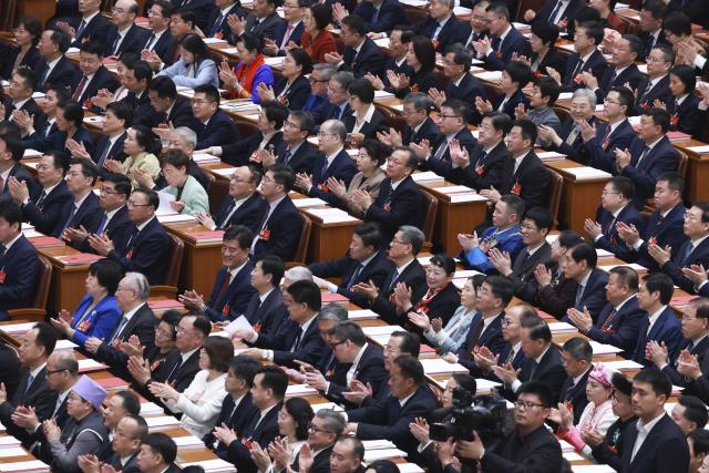 (260312) -- BEIJING, March 12, 2026 (Xinhua) -- The closing meeting of the fourth session of the 14th National People's Congress (NPC) is held at the Great Hall of the People in Beijing, capital of China, March 12, 2026. (Xinhua/Ding Lin)