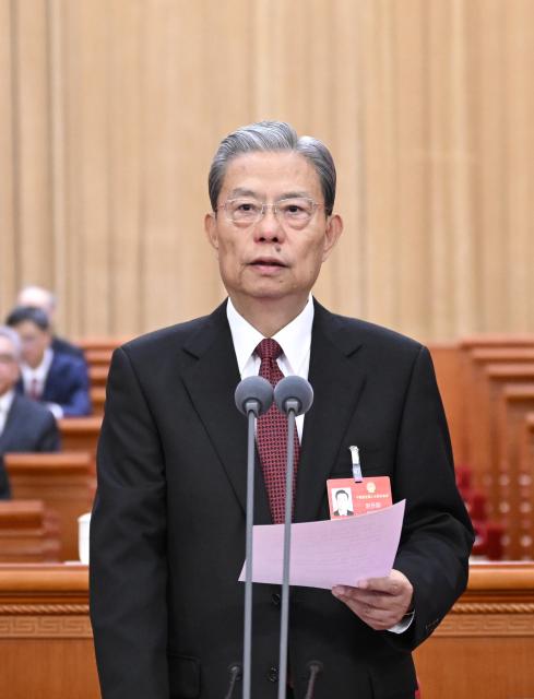 (260312) -- BEIJING, March 12, 2026 (Xinhua) -- Zhao Leji presides over the closing meeting of the fourth session of the 14th National People's Congress (NPC) at the Great Hall of the People in Beijing, capital of China, March 12, 2026. Zhao delivered a speech at the meeting on Thursday. (Xinhua/Shen Hong)